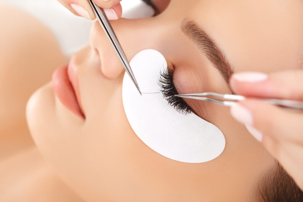 Person working on someone els's eye lash extension